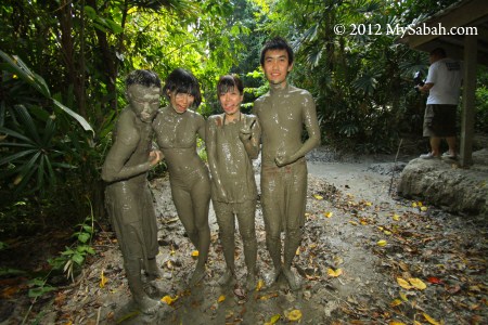 muddy tourists at mud volcano