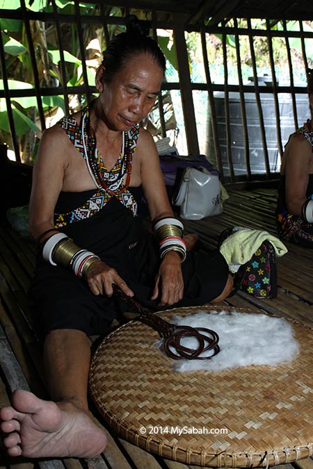 Rungus woman making cloth made from cotton