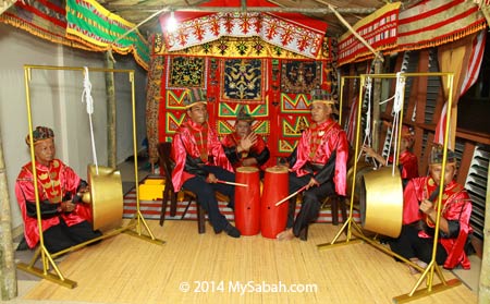 Land Bajau playing gong