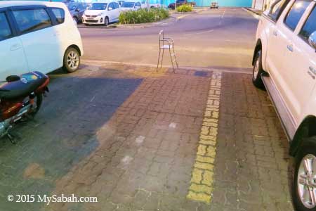 occupy parking lot with chair