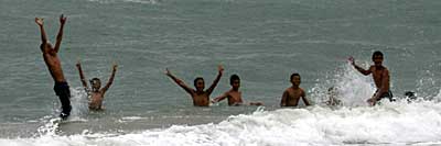 Kids swimming at Tanggui Beach