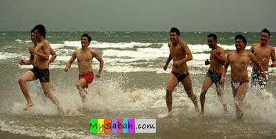 Models running on beach