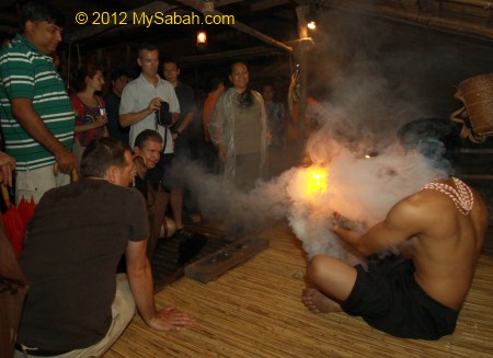 tourists looking at fire starting