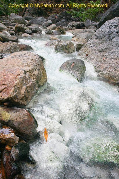 Snowy stream of sulphurous spring