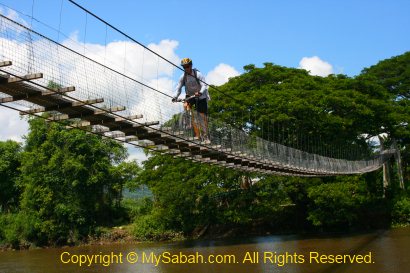 Cycling stunt on suspension bridge