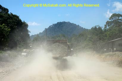 Truck on dusty gravel road
