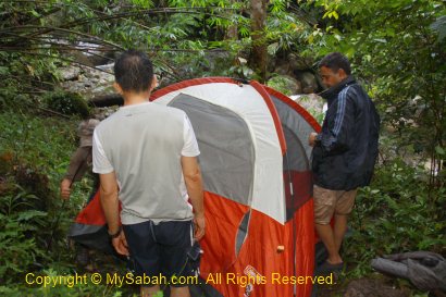 setting up camping tent