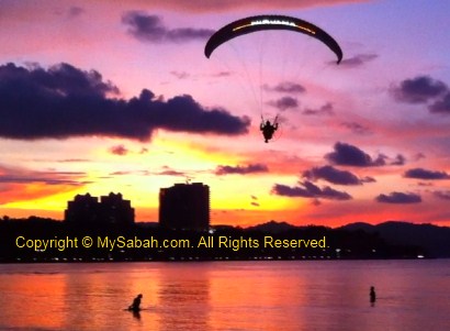 Paramotor in sunset of Kota Kinabalu