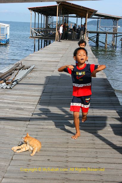 Kids running on boardwalk