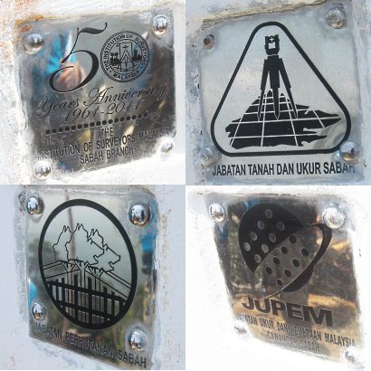 logos on Center of Sabah Monument