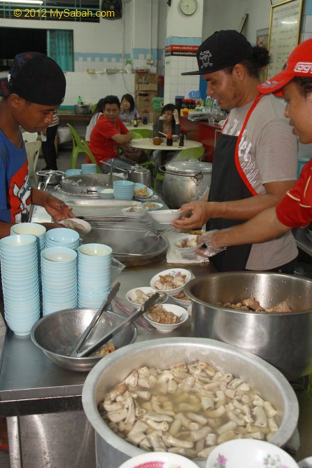 workers preparing Bak Kut Teh