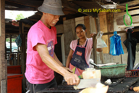 cutting BBQ coconut