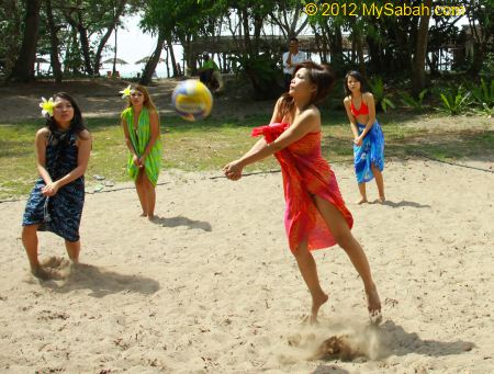 Miss Oriental contestants playing beach volleyball