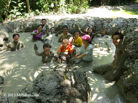 soaking in mud volcano of Survivor Island
