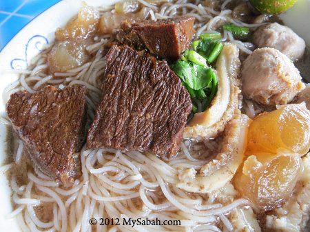 close-up of ngiu chap / beef noodle soup
