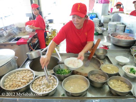 staff preparing Sang Nyuk Mee (Pork Noodle)