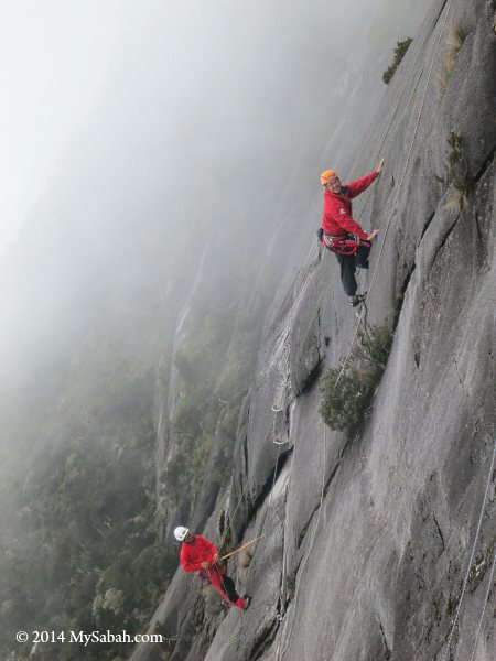 climbing on foggy slope