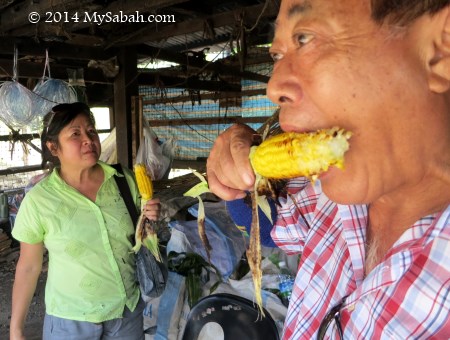 eating grilled corn