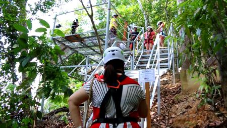 trekking to starting point of zipline