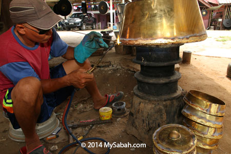 craftsman making gong