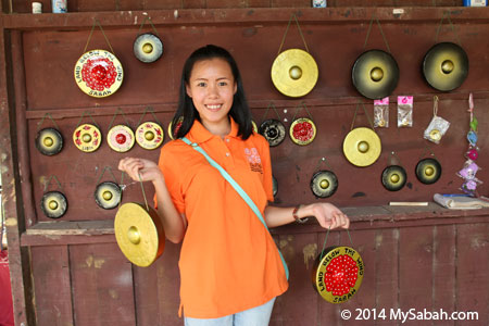 girl holding gong handicraft