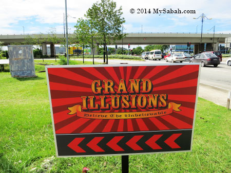 road signage of Grand Illusions