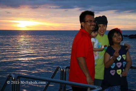 family shot with sunset