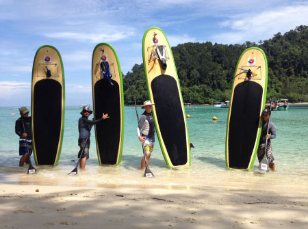 taking Stand Up Paddle Boarding lesson on the sea