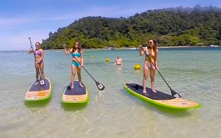 girls doing Stand Up Paddle Boarding