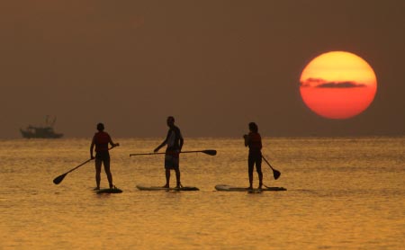 Stand-Up Paddleboarding to sunset