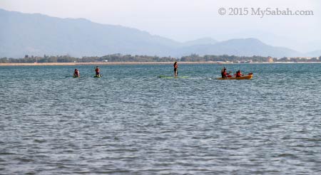 Stand-up paddle-boarding group on the sea