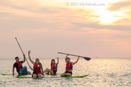 sunset group photo on standup paddleboard