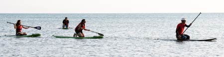 Stand-up paddle-boarding on the sea of Tanjung Aru First Beach