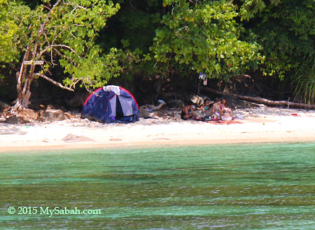 tourists camping on the beach