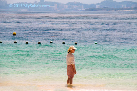 girl walking in the sea