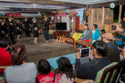 Guests enjoying the traditional dance performance