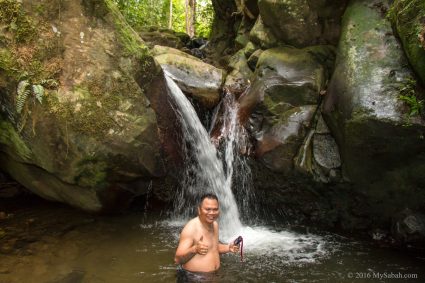Swimming under Kolopis Sunsuron Waterfall