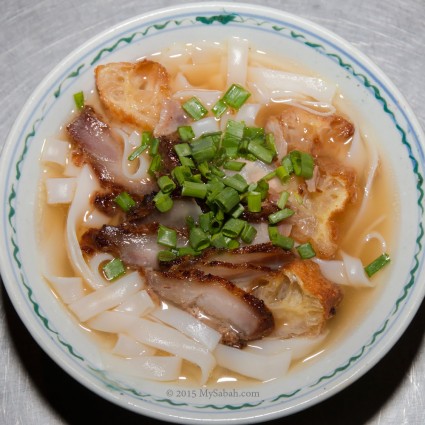 Kueh Teow noodle soup with deep-fried pork