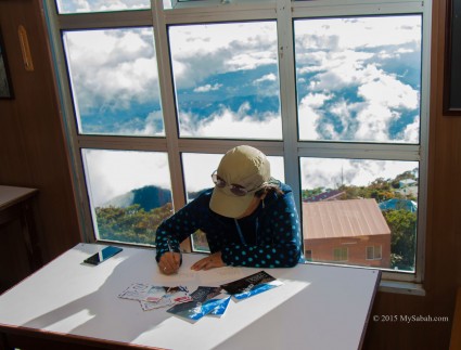 Writing postcards in Pendant Hut