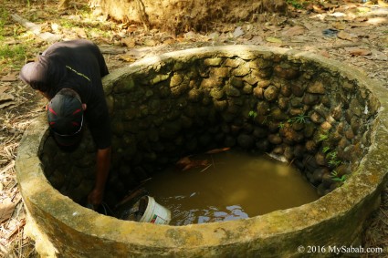 Villager taking water from the well