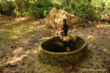 Villager sitting on the well