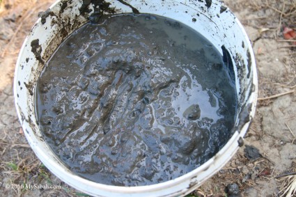 A bucket of mud from mud volcano