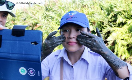 Applying volcano mud on the face