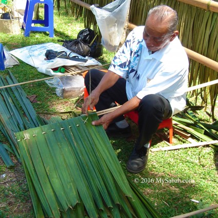 Making roof with sago fronds