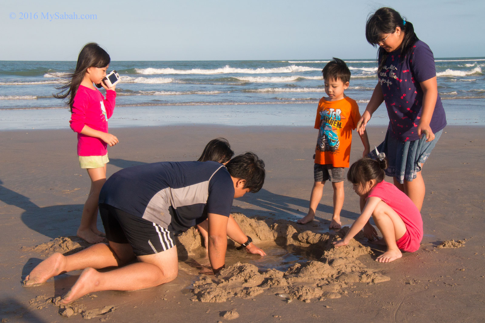 Kids playing with sand