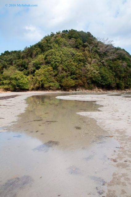 The sand bar of Kelambu Beach is flooded during high tide