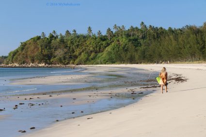 Tourist walking on the beach