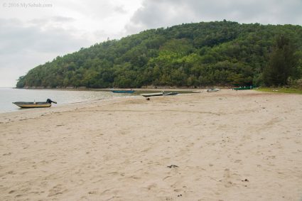 Loro Kecil cove surrounded by lush hill