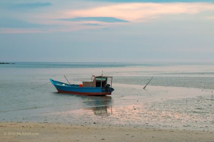 Small boat resting on the beach