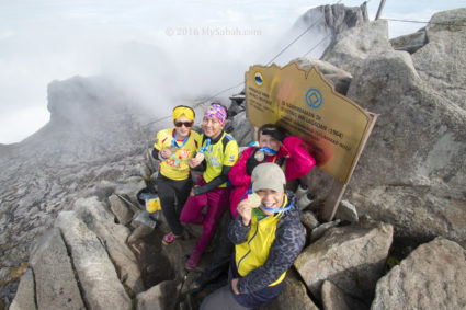 Happy lady climbers on the summit